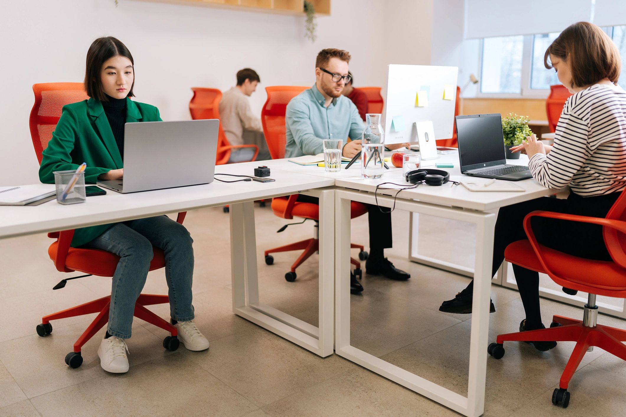 Cloud4Hosting team collaborating in a modern office